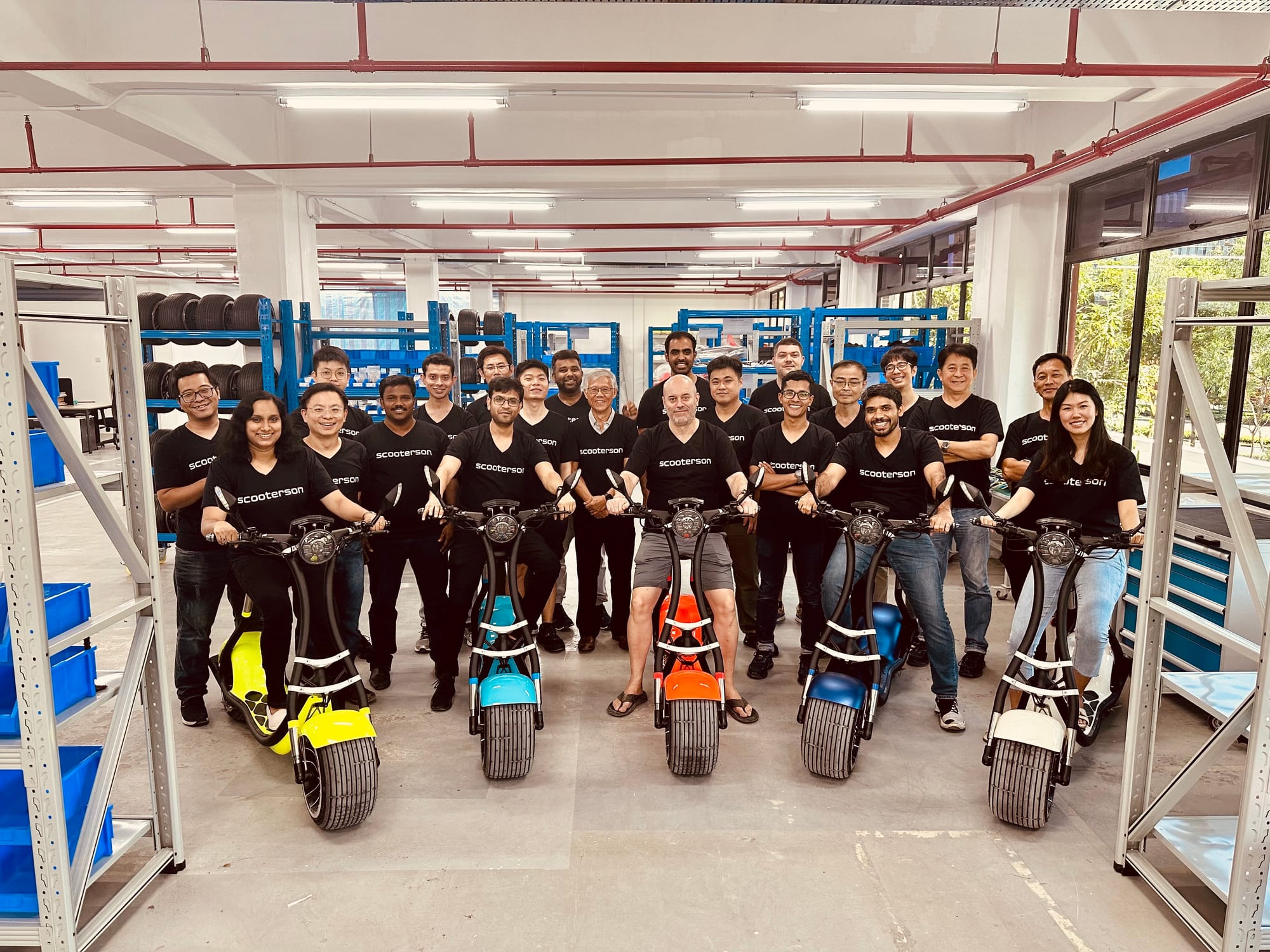The Scooterson team in the factory, with five Rolley scooters in front
